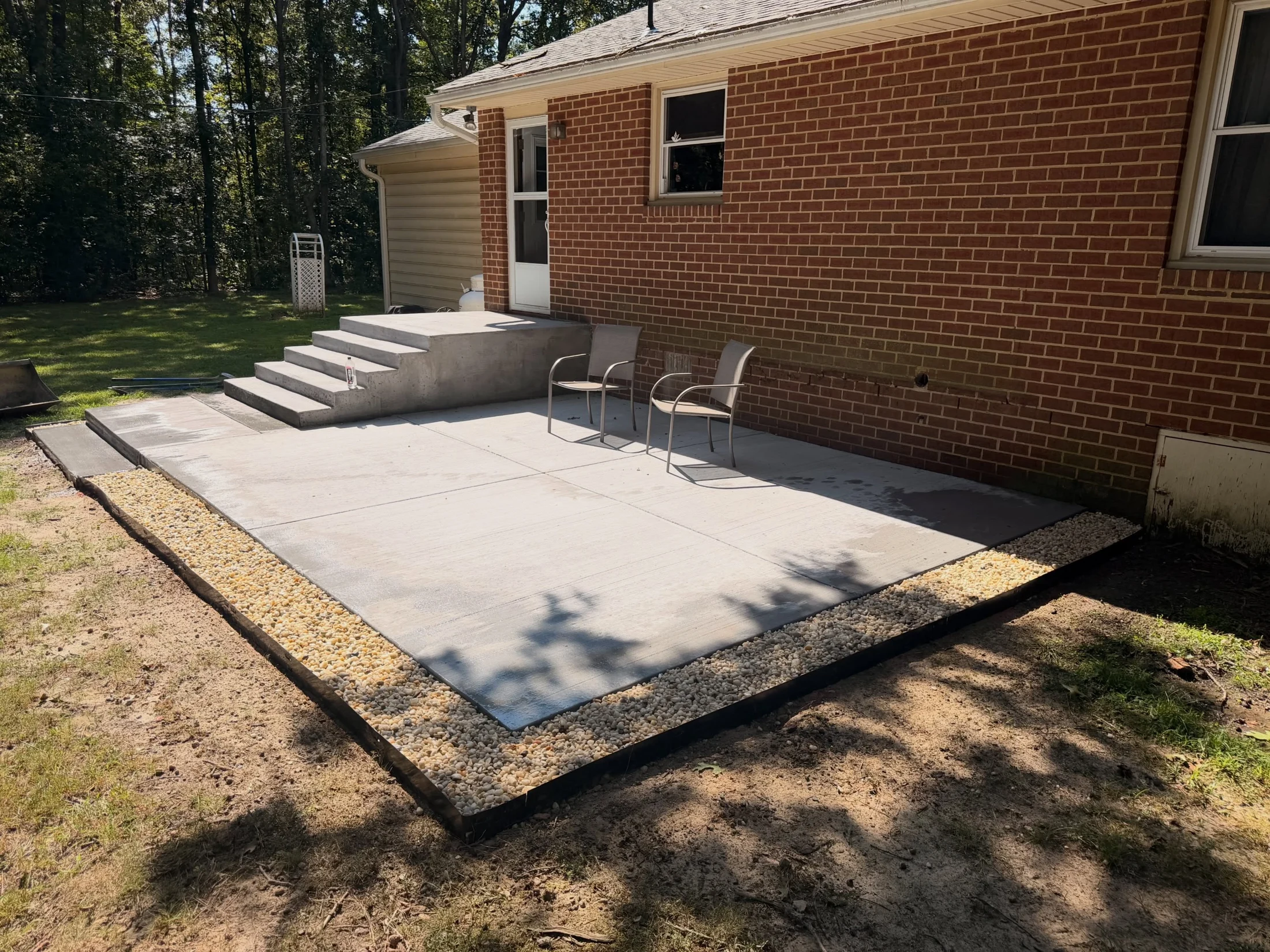 Concrete patio beside a home